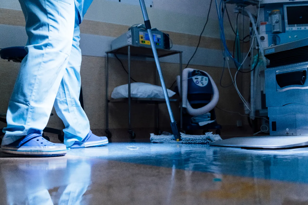 Hospital worker cleaning medical area