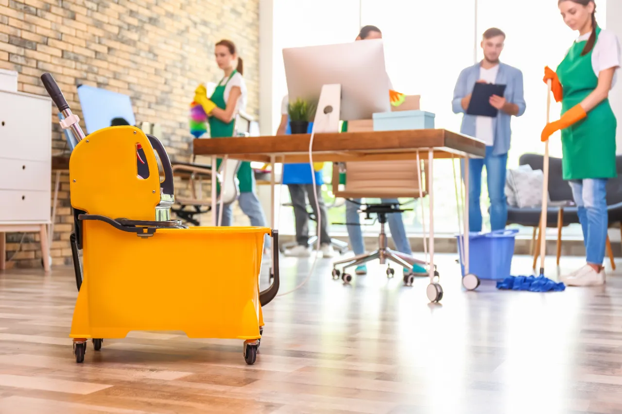Office floor cleaning team